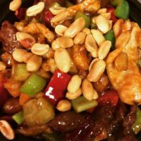 CS9. Kung Pao Delight · Beef, chicken, shrimp with carrots, celery and water chestnuts sautéed in special sauce. Spi...
