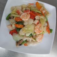 CS10. Seafood Platter · Crabmeat, scallops, fish fillets, squid and shrimp sauteed with vegetables served in a speci...