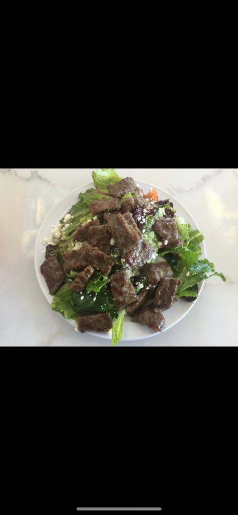 Gyros Salad (half) · Greek salad topped with beef and lamb gyros.