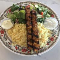 Chicken Kabobs Plate · 2 chicken skewers served with rice pilaf, salad, tzatziki, and garlic sauce. Served with pit...