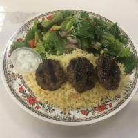 Kafta Kabobs Plate · 3 ground beef patties served with rice pilaf, salad, and tzatziki. Served with pita bread.