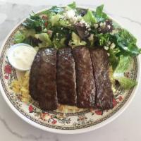 Gyros Plate · 5 strips of grilled beef and lamb gyros served with rice pilaf, Greek salad, and tzatziki. S...