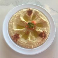 Hummus Dip · Garbanzo beans dip served with pita.
