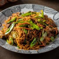 Golden Noodles · Stir-fried egg noodles with egg, carrot, snow peas, straw mushrooms and Chinese broccoli wit...