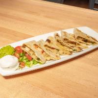 Grilled Steak Quesadillas · Onion, serrano peppers, Mexican spices, jack