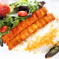 9. Ground Chicken Kabob Plate · Served with hummus, white basmati rice, salad, pita bread, grilled tomato & jalapeno.