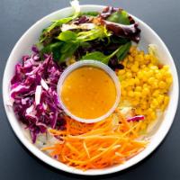 House Salad · Lettuce, tomatoes, carrots, corn, red cabbage and Italian dressing on the side.