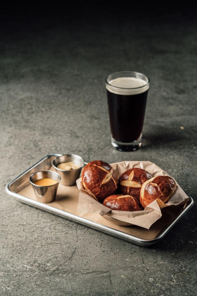 Pretzel Bread · 4 mini buns served hot from the oven with a side of cheese sauce and Sierra Nevada beer mustard for dipping.
