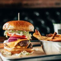 Diner Burger · Two 1/4 lb. patties hand-pressed thin and cooked on flat top grill. Served with lettuce, tom...