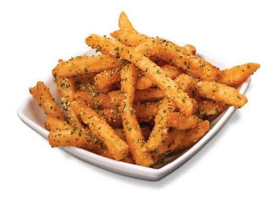 Seasoned Fries · Our french fries are tossed with house seasoning and Parmesan cheese, topped with parsley flakes for garnish. Served with a side of ketchup. Vegetarian.