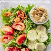 Garden Salad · Fresh greens, tomatoes, cucumber, carrots, croutons and dressing.