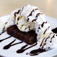 Ghirardelli Brownie Sundae · A Ghirardelli brownie topped with vanilla bean ice cream, whipped cream and chocolate sauce.