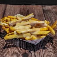 Cheese Fries  · Fresh cut daily, double blanched and topped with queso cheese.