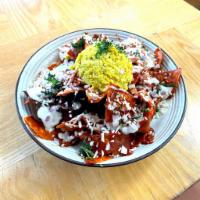 Chilaquiles · Corn tortillas in choice of spicy red or green sauce with 