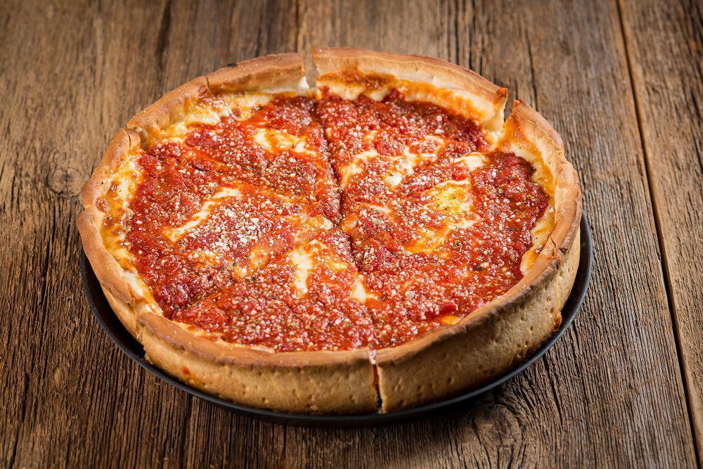 Chicago-Style Deep Dish Pizza · Chicago’s famous deep dish is a buttery crust filled with mounds of mozzarella cheese and topped with Rosati’s Chicago-style sauce.