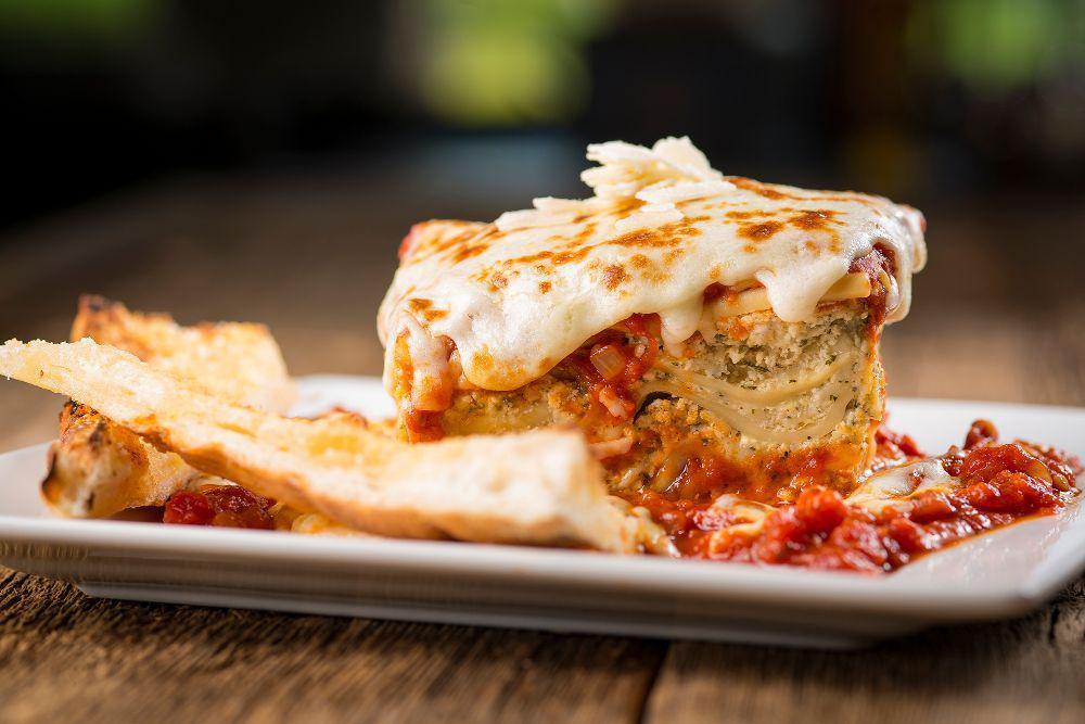 Baked Lasagna · Serves one to two. Layers of ribbon noodles and three cheeses, smothered in marinara sauce and baked mozzarella cheese.
