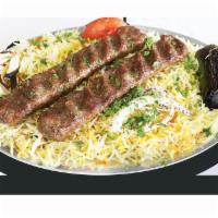 Kefta Kabob · Ground lamb mixed with fresh parsley and onions served with rice and tomato.