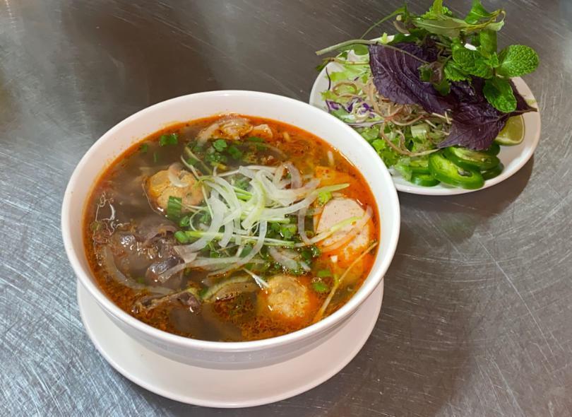 22. Bun Bo Hue  · Spicy beef noodle soup. Served spicy. Round shanghai rice noodle, beef shank, slice Vietnamese pork ham, and pork picnic in a spicy lemongrass beef broth.