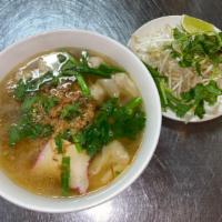 24. Mi Hoanh Thanh · Wonton noodle soup. Shrimp and pork wontons, BBQ pork, and minced pork in a savory pork brot...