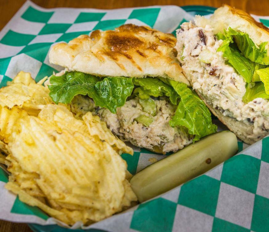 Chicken Salad Sandwich · Roasted chicken breast, celery, grapes, pecans, and lettuce. Served on European bread, pickle spear, and chips.