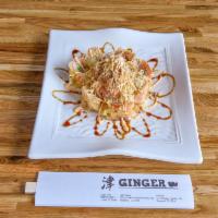 R4. Miami Roll · Spicy tuna, avocado wrapped in soy paper deep-fried and topped with crab meat, crunchy flake...