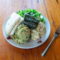 Mediterranean Sampler · Our tabouli, hummus, Greek salad, with rice stuffed grape leaves and pita
bread. Vegetarian.