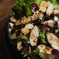 Tutto Salad · Mixed greens, chicken, cranberries, almonds and feta cheese with passion fruit dressing.