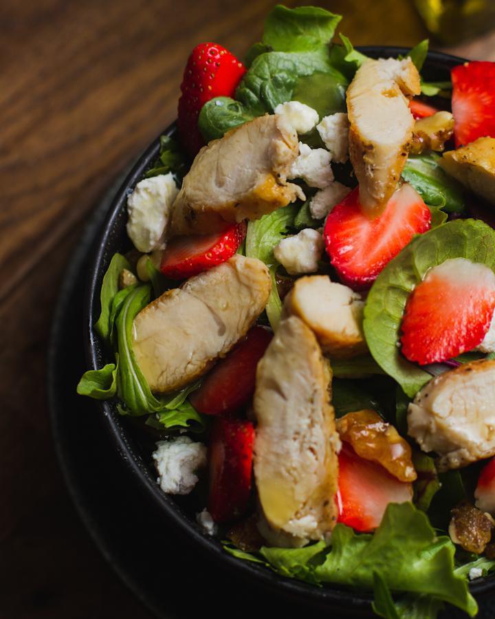 Fragole Salad · Mixed greens, goat cheese, caramelized walnuts, strawberries, grilled chicken and apple-cider dressing.