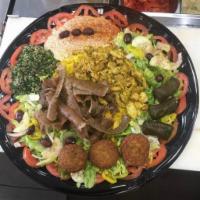 Family Platter · Serves 3 people. 
Falafel, gyro, chicken shawarma, hummus, baba ganoush, dolmades, rice or f...