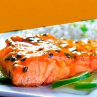 3. File de Salmao Ao Molho de Maracuja (Salmon with Passion Fruit Sauce) · Servido com arroz  e vegetais grelhados.
Fresh salmon filet with homemade passion fruit sauc...
