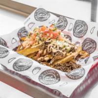 Carne Asada Fries · Fresh cut french fries topped with Asada (steak) or (choice of meat), cheese, chipotle sour ...