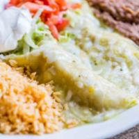 Enchiladas Verde · 3 enchildas covered in roasted green tomatillo sauce and Monterey Jack. Served with Mexican ...