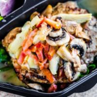 Chicken Alicia · Grilled chicken breast served over a bed of spinach topped with sauteed field mushrooms and ...