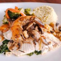 Hawaiian Sand Fish · Lightly sauteed and served over a bed of spinach with shrimp and field mushrooms in a light ...