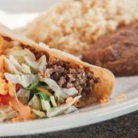 Crispy Taco · Served with rice and beans