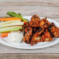 Blackened Chicken Wings · Served with celery and carrot sticks and blue cheese dressing. Gluten free.