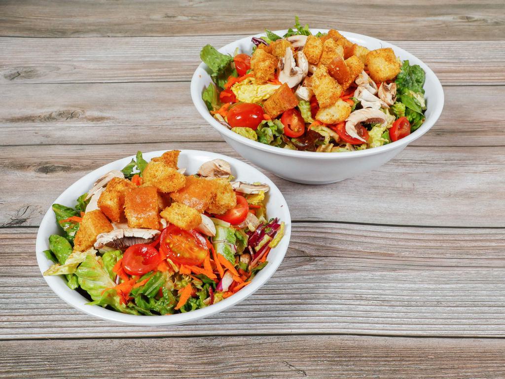 Garden Salad · Mixed greens, garden vegetables and homemade croutons with choice of dressing.