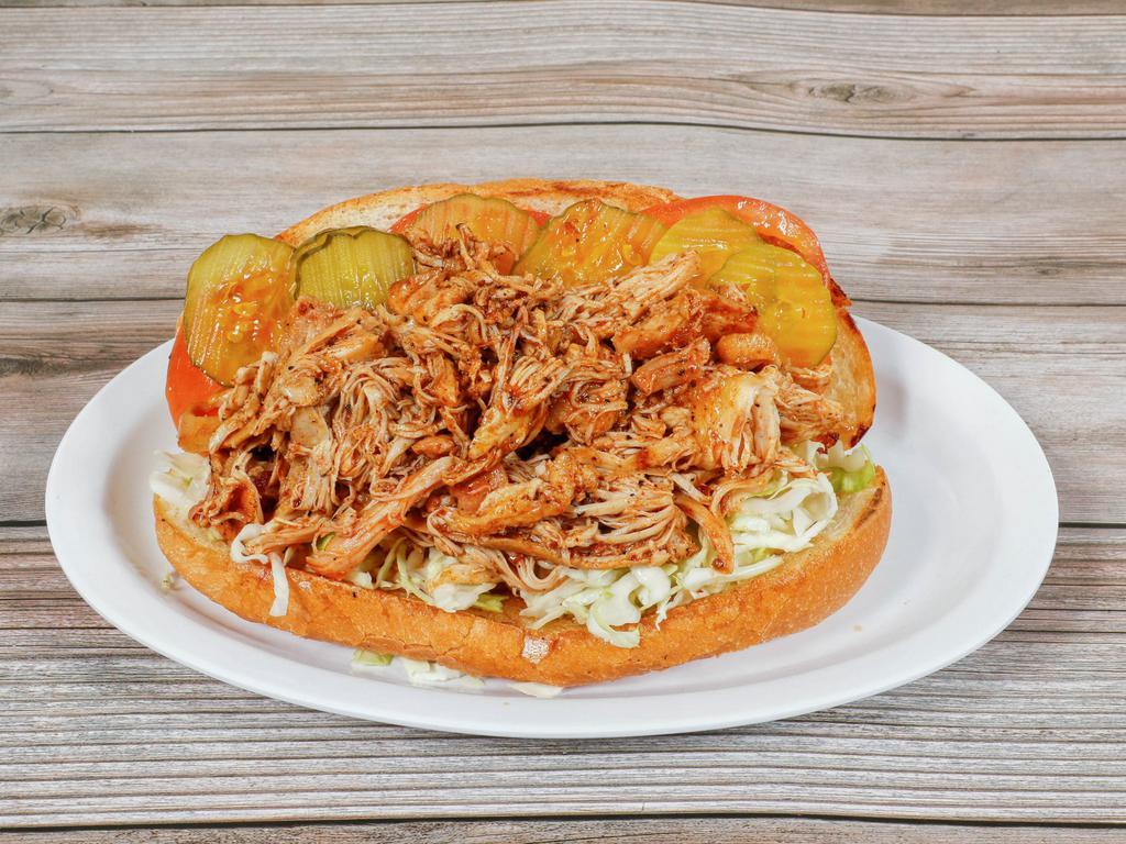 BBQ Chicken Po Boy · Shredded chicken in a spicy and tangy New Orleans sauce, dressed without mayo and creole mustard on a New Orleans style French roll.