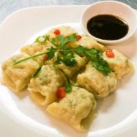 Dim Sim  · Steamed ravioli stuffed with shrimp, fresh crabmeat and herbs served with house dipping sauce.