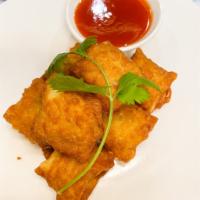 Fried Thai Ravioli  · Fried ravioli filled with shrimp and fresh crab meat and herbs. Served with sweet peach sauce.
