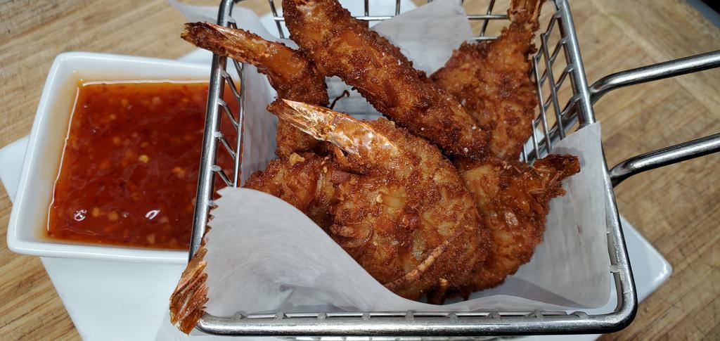 Coconut Shrimp · Jumbo shrimp tossed in our homemade batter and coconut flakes, served with sweet Thai chili dipping sauce.
