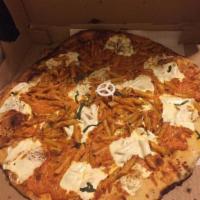 Penne Vodka Pizza · Penne tossed in our homemade vodka sauce on a fresh mozzarella base.