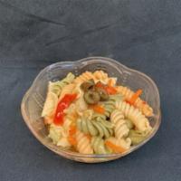 Tri Color Pasta Salad · Tri-color noodles in an Italian sauce with black olives and tomato pieces.