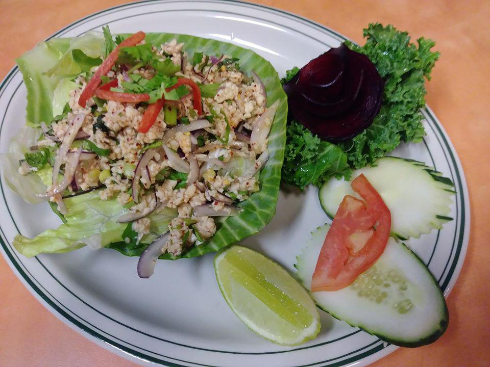 Labb Gai Salad · Chicken salad. Chopped chicken with lime juice, onion, toasted rice, mint leaves served with cucumber, cilantro, and fresh lettuce. Substitute beef for an additional charge.