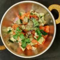 Shirazi Salad · Chopped cucumber, tomato, onion, mint with lemon juice, and olive oil dressing.
