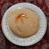 Hummus Dip · Chickpeas lightly blended with tahini sauce, olive oil, lemon juice and fresh garlic served ...