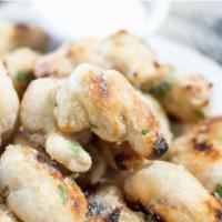 Garlic Knots · Our Neapolitan dough tied into knots, baked, and coated with garlic oil, Italian parsley, an...