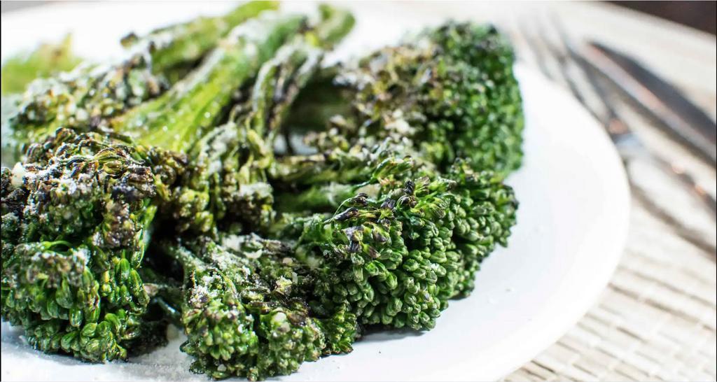 Grilled Broccolini · Broccolini tossed in garlic oil & lemon, grilled, and topped with Parmesan cheese.