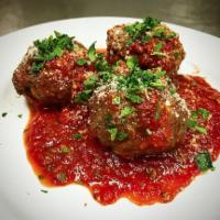 Meatballs · 3 house-made meatballs in a cast-iron skillet served with marinara, Parmesan, Italian parsle...