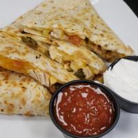 Chicken Quesadilla · Grilled chicken, cheddar jack, tomatoes, and jalapenos with salsa & sour cream